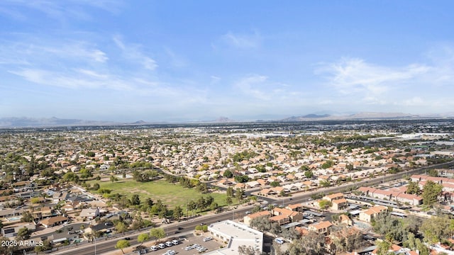 birds eye view of property with a mountain view and a residential view