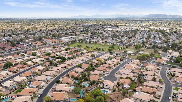 drone / aerial view with a residential view and a mountain view