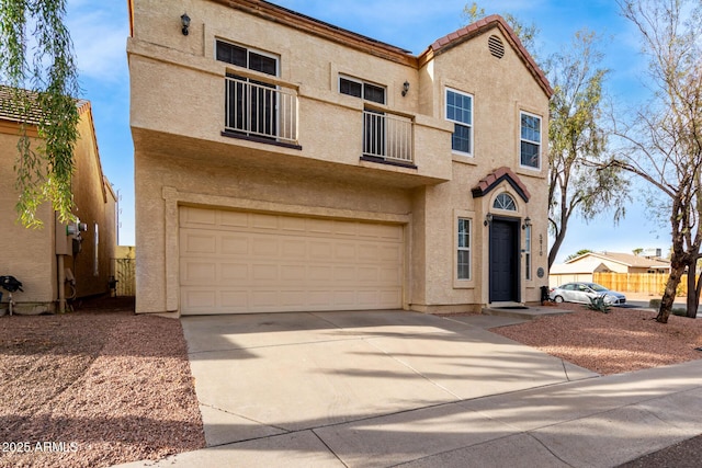 view of front facade with a balcony and a garage