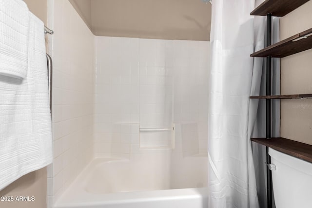 bathroom with shower / tub combo with curtain