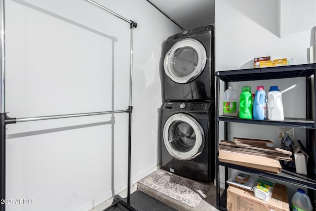 laundry area with stacked washer / dryer