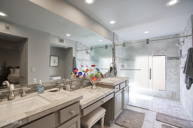 bathroom with a stall shower, vanity, and recessed lighting