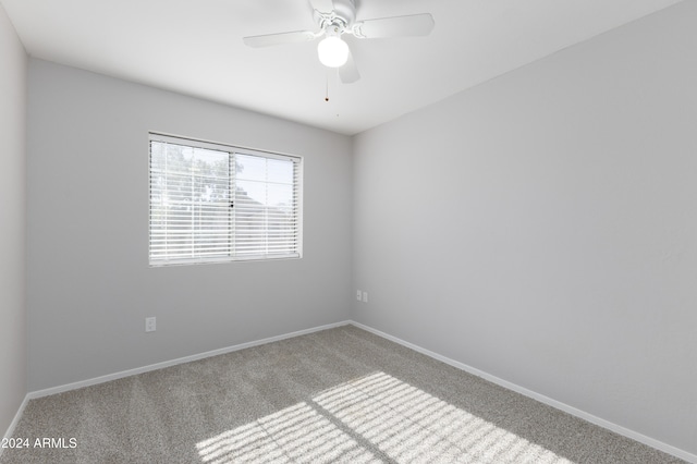 carpeted empty room with ceiling fan