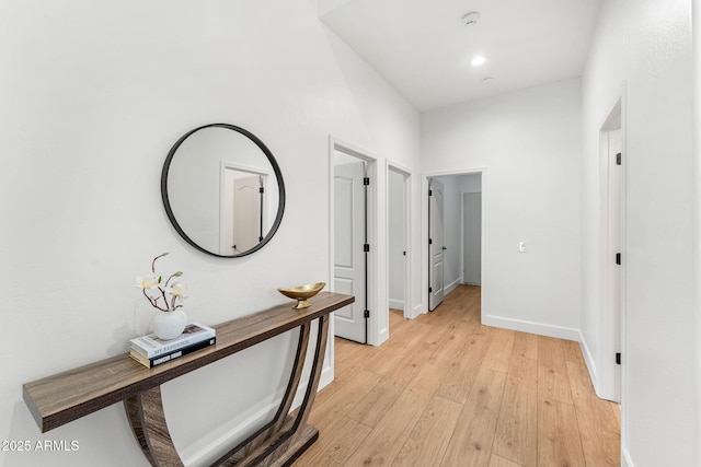 hall with light hardwood / wood-style floors