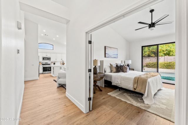 bedroom featuring multiple windows, access to exterior, and light hardwood / wood-style flooring