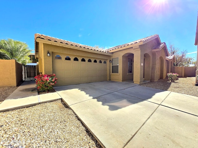 mediterranean / spanish-style house featuring a garage