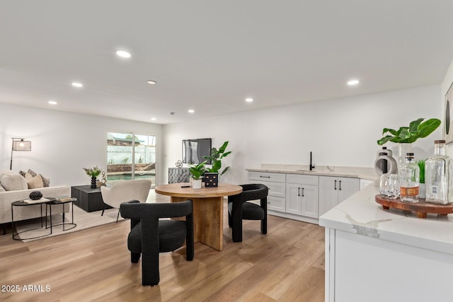 dining room featuring recessed lighting and light wood-style floors