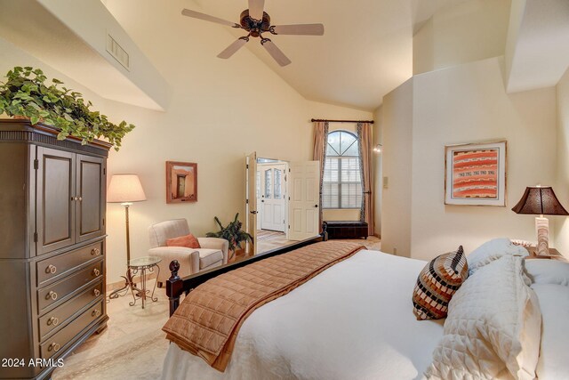 bedroom with a ceiling fan, high vaulted ceiling, and visible vents