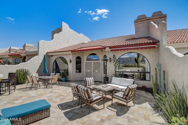 view of patio / terrace featuring an outdoor hangout area and outdoor dining area
