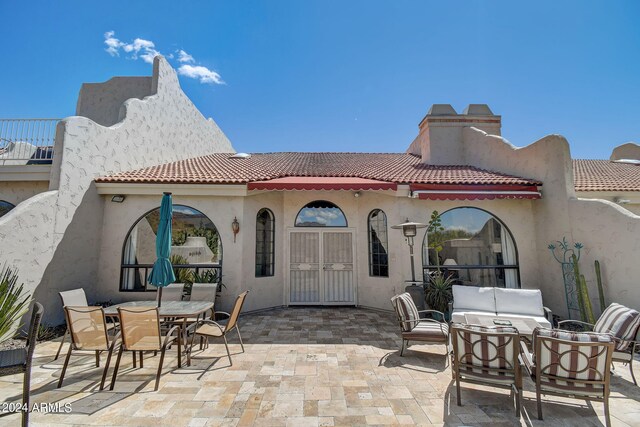 view of patio / terrace featuring an outdoor hangout area and outdoor dining area