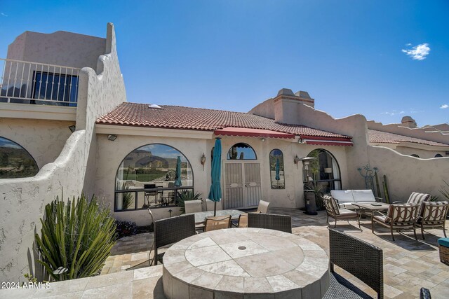 view of patio / terrace featuring outdoor dining area and an outdoor living space