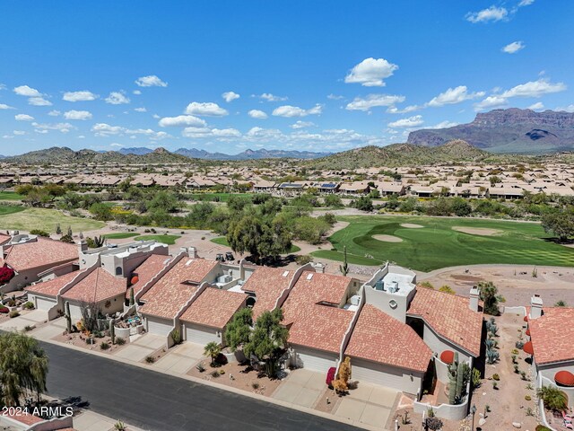 birds eye view of property with a mountain view, view of golf course, and a residential view