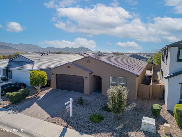 view of front of house featuring a mountain view and a garage