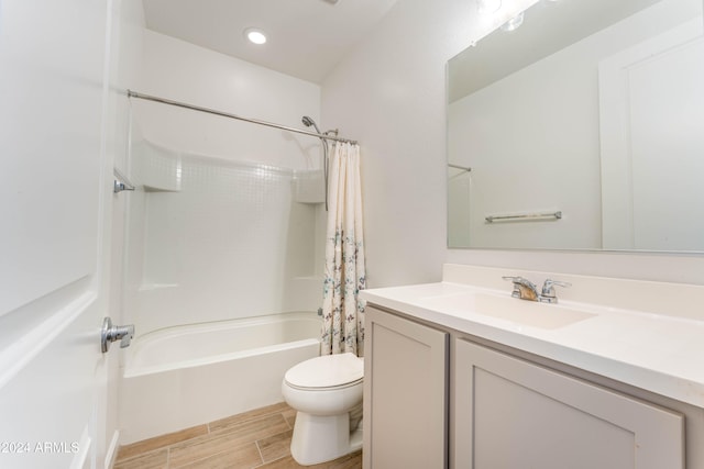 full bathroom with vanity, toilet, and shower / tub combo with curtain