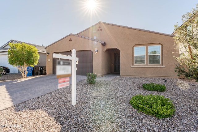 view of front of property with a garage