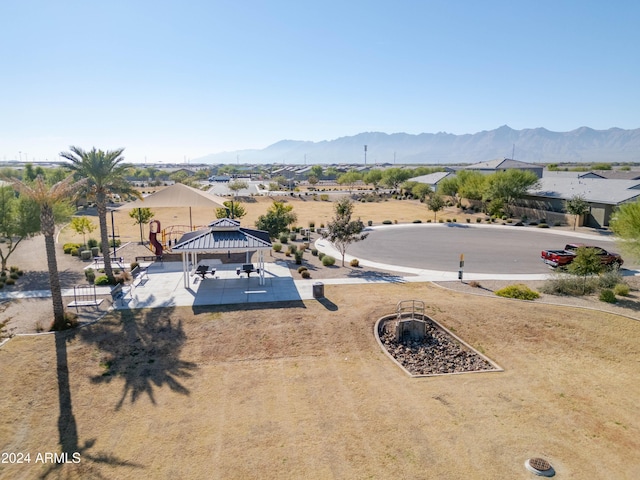 birds eye view of property with a mountain view