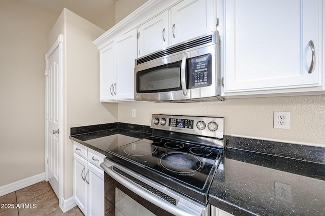 3897 E Douglas Loop, Gilbert, AZ 85234 - kitchen featuring appliances with stainless steel finishes, white cabinets, dark stone countertops, and light tile patterned floors