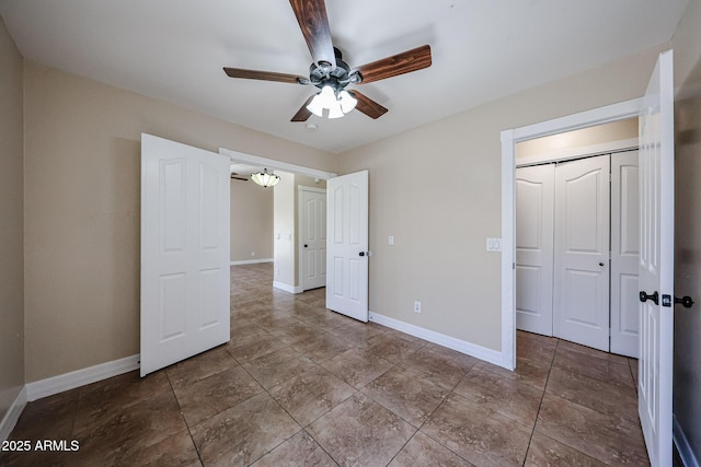 3897 E Douglas Loop, Gilbert, AZ 85234 - unfurnished bedroom featuring tile patterned floors, a closet, and a ceiling fan