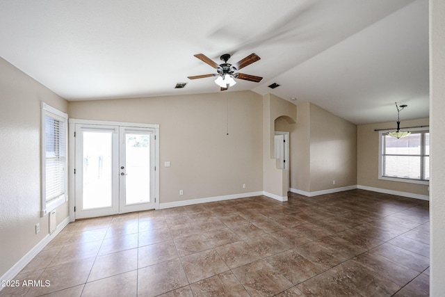 3897 E Douglas Loop, Gilbert, AZ 85234 - unfurnished room featuring vaulted ceiling, ceiling fan, arched walkways, tile patterned floors, and french doors
