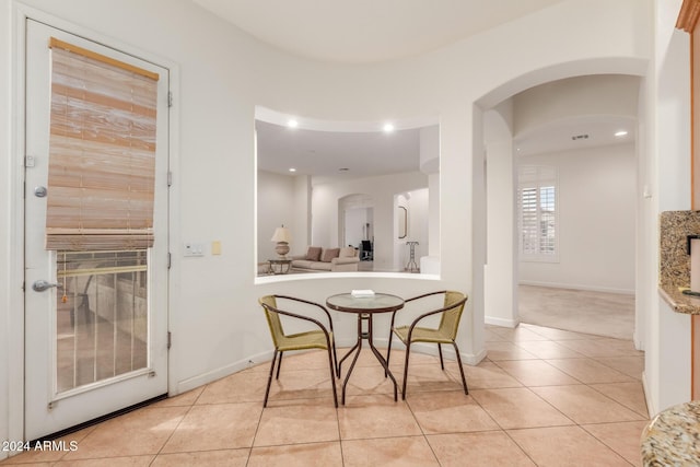 dining space with light tile patterned floors