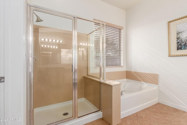 bathroom with tile patterned flooring and plus walk in shower