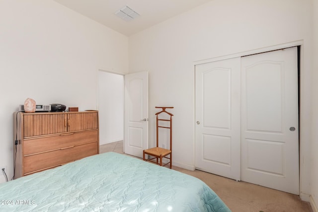 carpeted bedroom with a closet