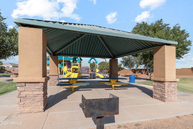 view of patio / terrace featuring a gazebo and a playground