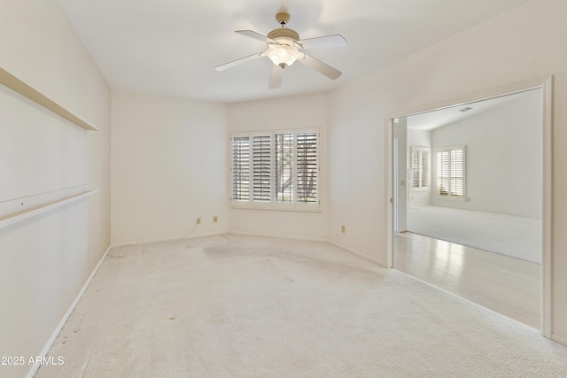 10609 E Cedar Waxwing Dr, Sun Lakes, AZ 85248 - carpeted spare room with baseboards and a ceiling fan