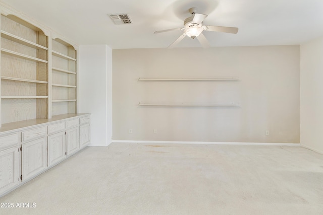 10609 E Cedar Waxwing Dr, Sun Lakes, AZ 85248 - interior space featuring visible vents, baseboards, a ceiling fan, and light carpet