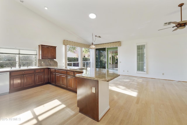 10609 E Cedar Waxwing Dr, Sun Lakes, AZ 85248 - kitchen featuring white dishwasher, a sink, ceiling fan, a peninsula, and light wood-style flooring