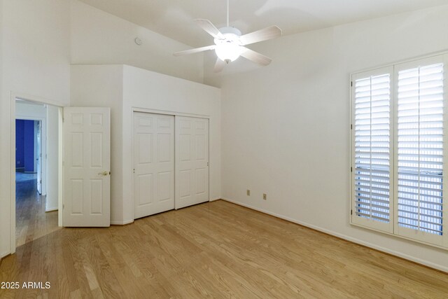 10609 E Cedar Waxwing Dr, Sun Lakes, AZ 85248 - unfurnished bedroom featuring light wood-style floors, a closet, ceiling fan, and baseboards