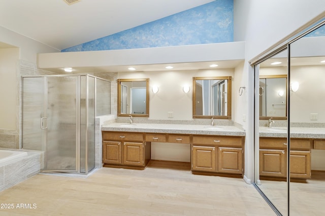 10609 E Cedar Waxwing Dr, Sun Lakes, AZ 85248 - bathroom featuring a shower stall, a bath, double vanity, and high vaulted ceiling
