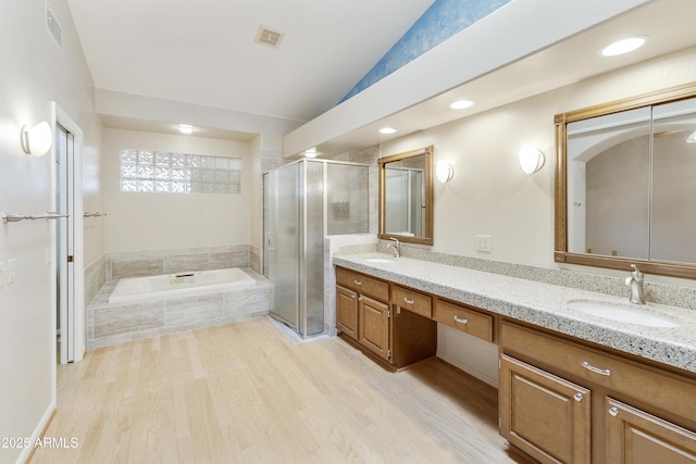 10609 E Cedar Waxwing Dr, Sun Lakes, AZ 85248 - full bathroom with a shower stall, wood finished floors, a sink, and vaulted ceiling