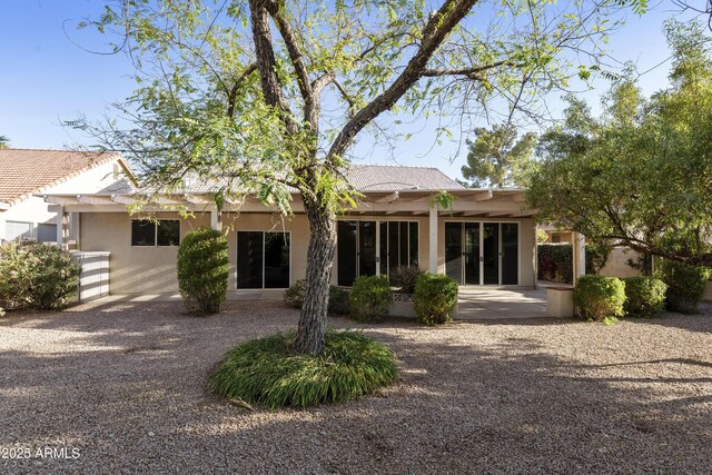 10609 E Cedar Waxwing Dr, Sun Lakes, AZ 85248 - back of property with a tiled roof and stucco siding