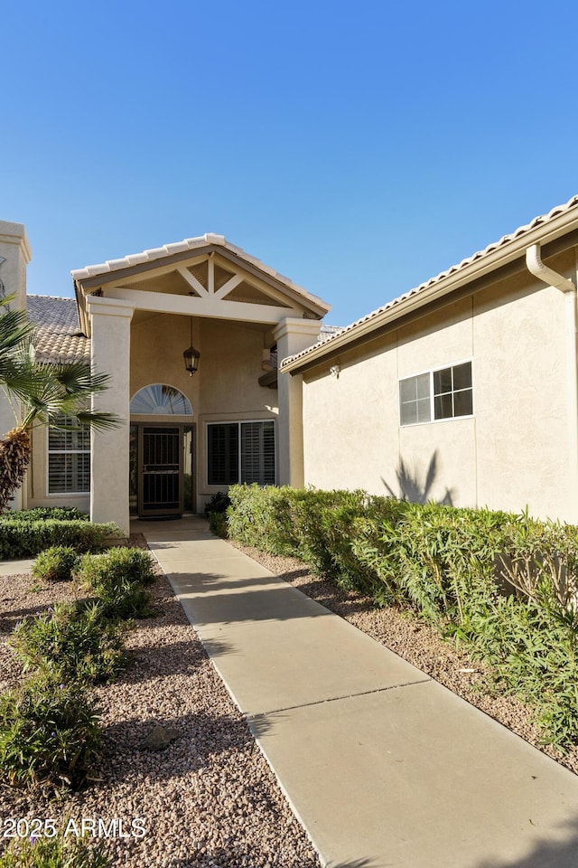 10609 E Cedar Waxwing Dr, Sun Lakes, AZ 85248 - view of exterior entry with stucco siding