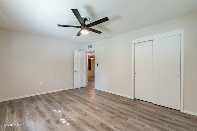505 W Howe St, Tempe, AZ 85281 - unfurnished bedroom featuring light wood-type flooring, a closet, baseboards, and a ceiling fan