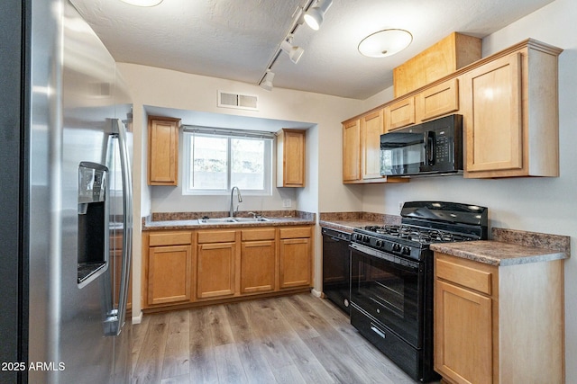 505 W Howe St, Tempe, AZ 85281 - kitchen with black appliances, a sink, light wood finished floors, track lighting, and light brown cabinets