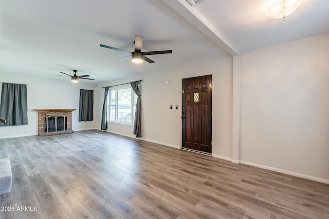 505 W Howe St, Tempe, AZ 85281 - unfurnished living room featuring wood finished floors, ceiling fan, and baseboards