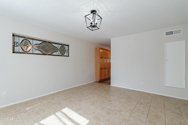 505 W Howe St, Tempe, AZ 85281 - spare room featuring light tile patterned flooring, a chandelier, and baseboards