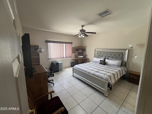 bedroom with a ceiling fan, visible vents, and light tile patterned floors