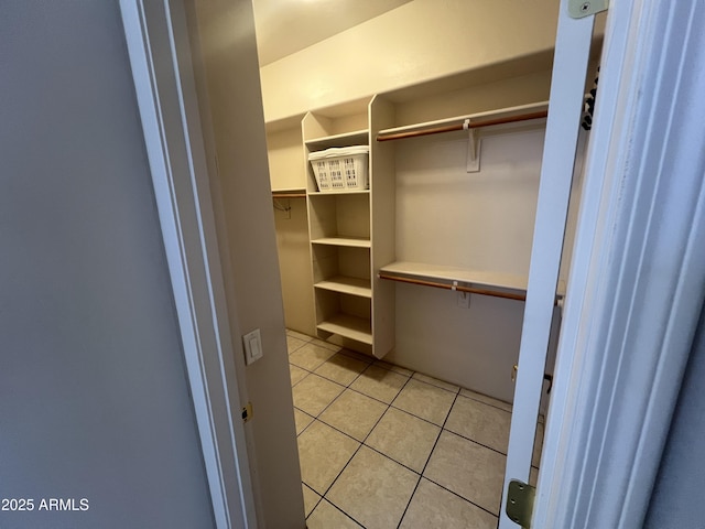 walk in closet featuring light tile patterned floors