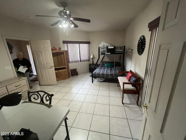 bedroom with a ceiling fan and light tile patterned floors