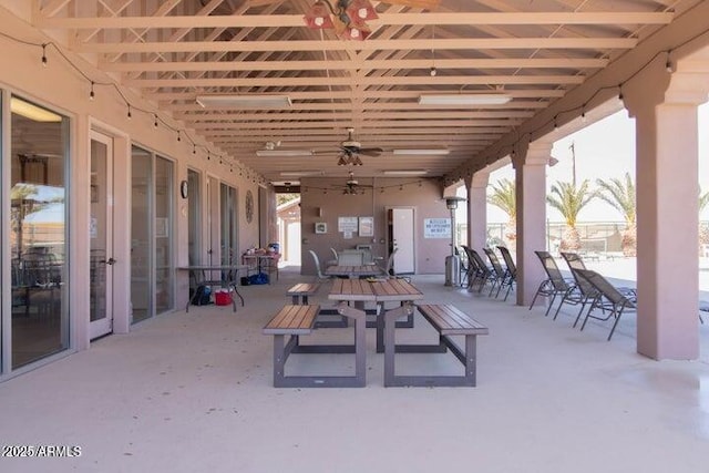 view of patio featuring a ceiling fan and outdoor dining space