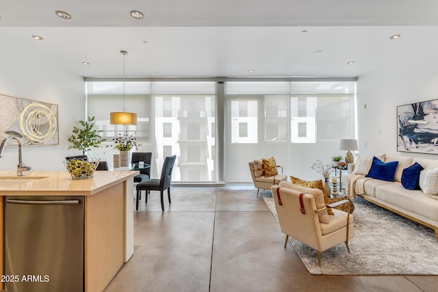 living room with finished concrete floors and recessed lighting