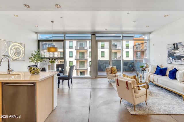 living room with concrete flooring and a wall of windows