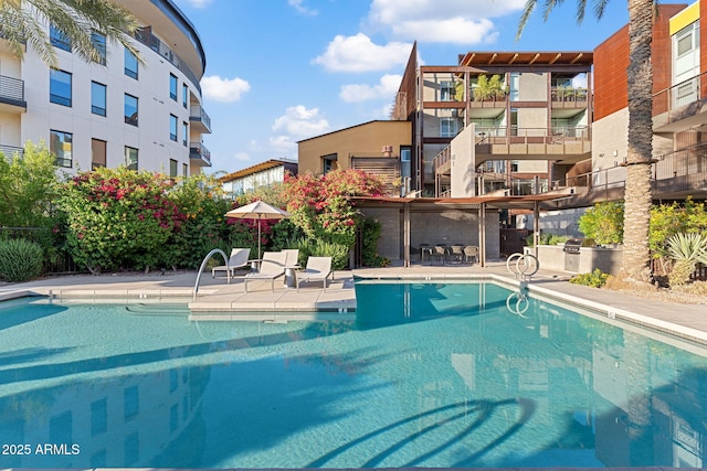 community pool with a patio area