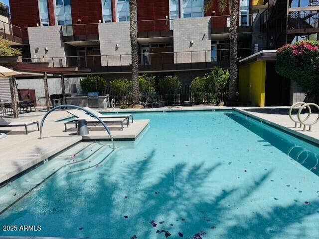 community pool featuring a patio area