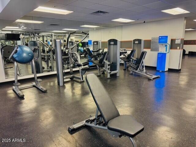 exercise room with a paneled ceiling