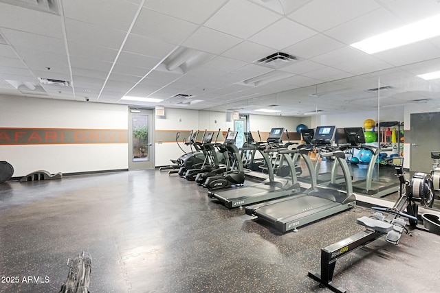 exercise room featuring a drop ceiling