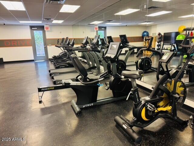 workout area with a drop ceiling